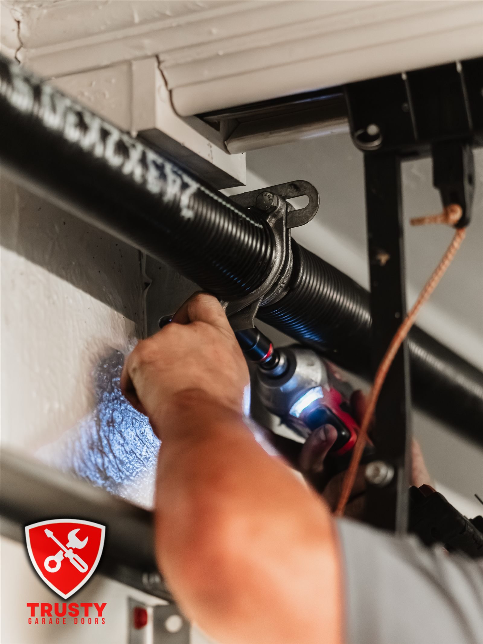 Tensioning a torsion spring in Dallas, TX