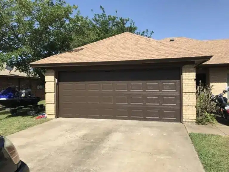 Garage Door Repair Coppell TX a garage with a brick roof in Coppell TX